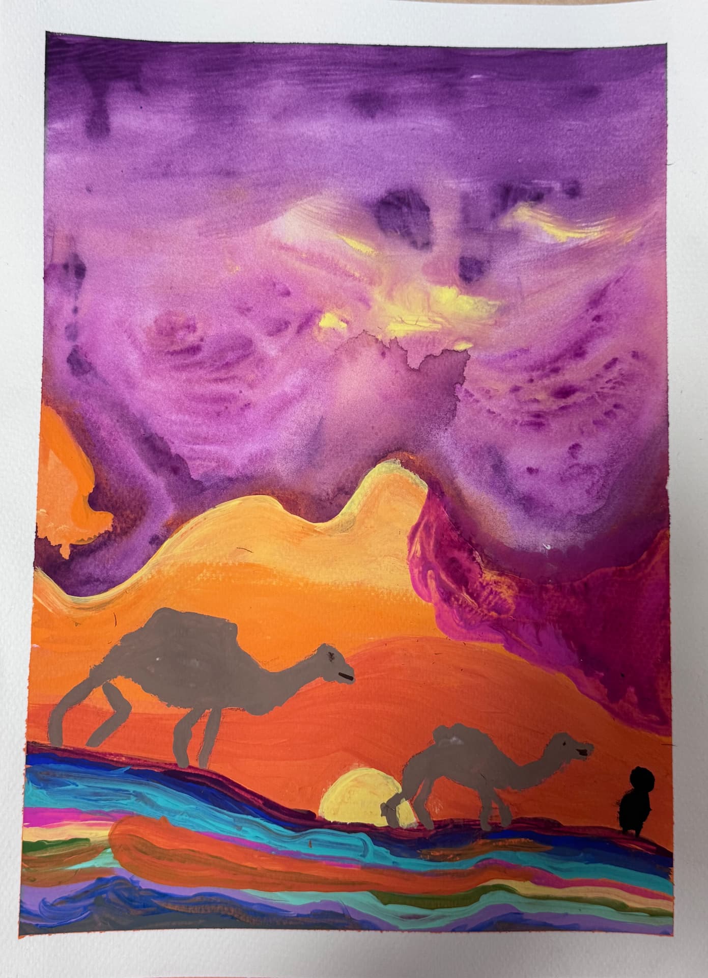 Camels crossing colourful desert dunes under a purple sky