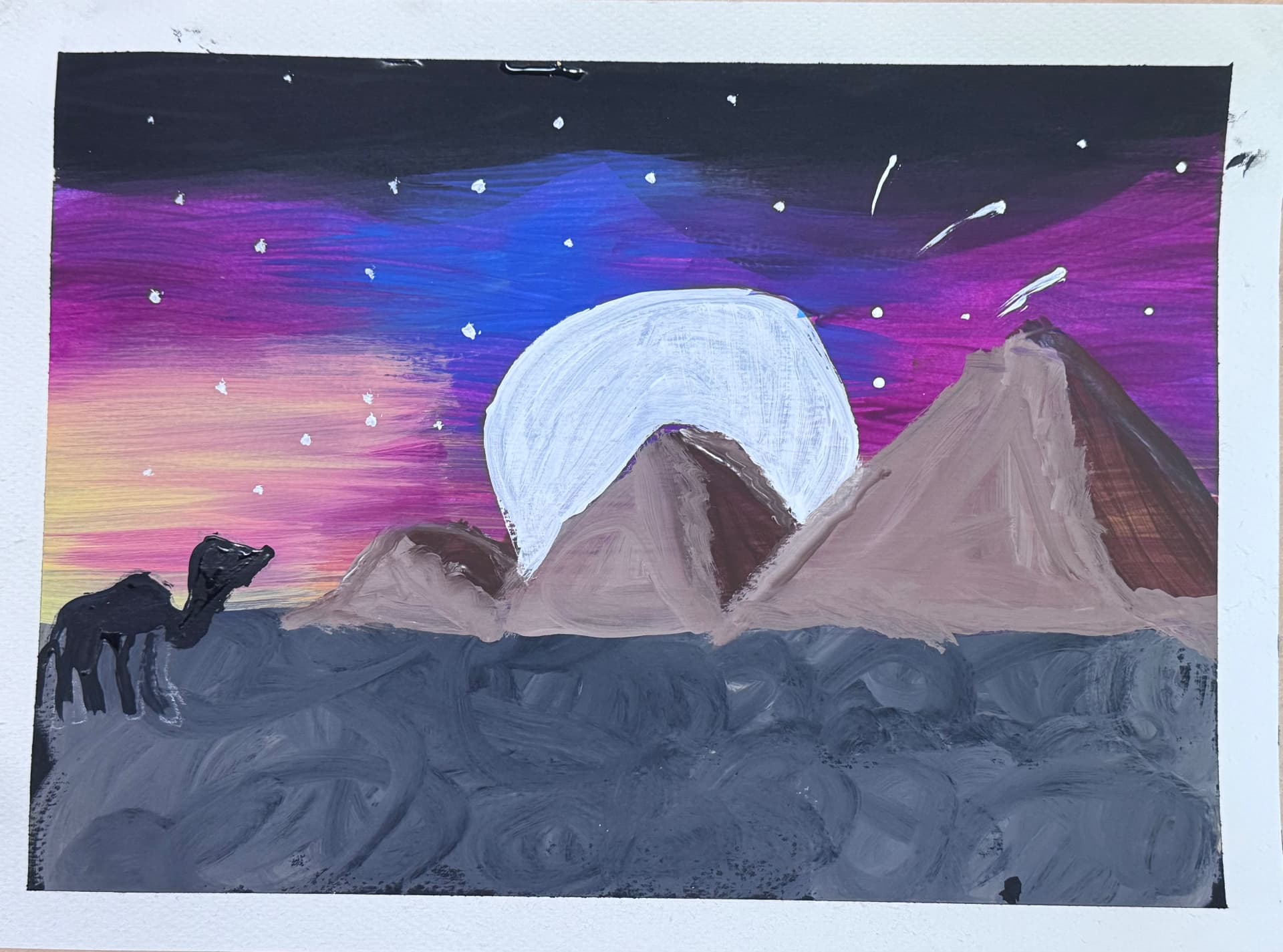 Camel watching pyramids beneath a purple night sky and moon