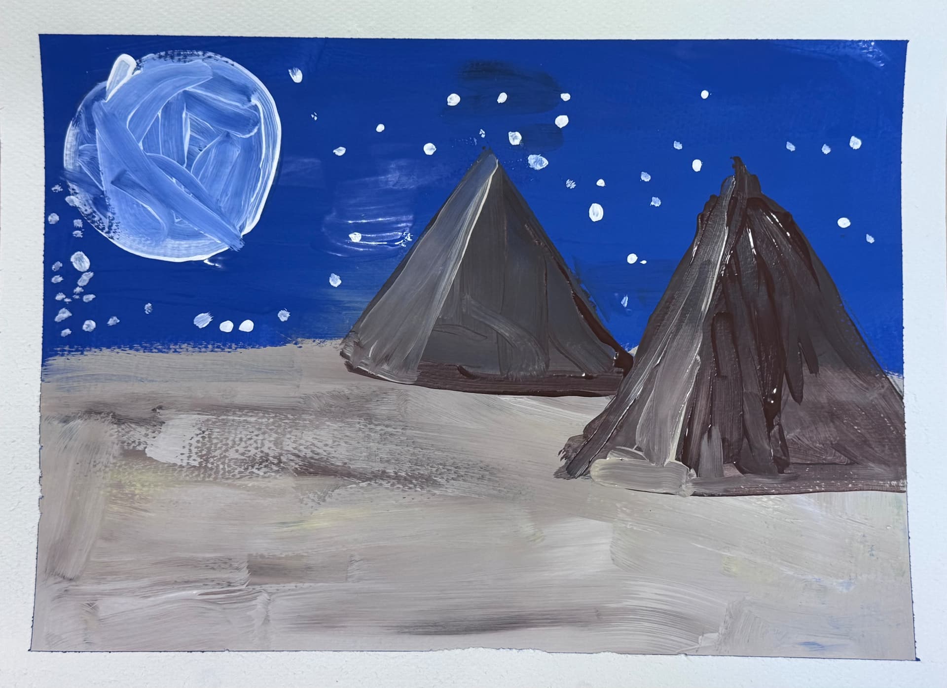 Pyramids under a big moon and starry blue sky